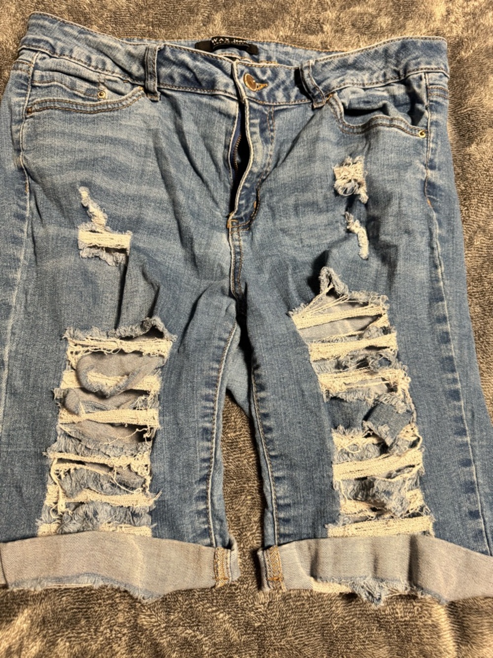 Woman’s Ripped Jean Bermuda Shorts